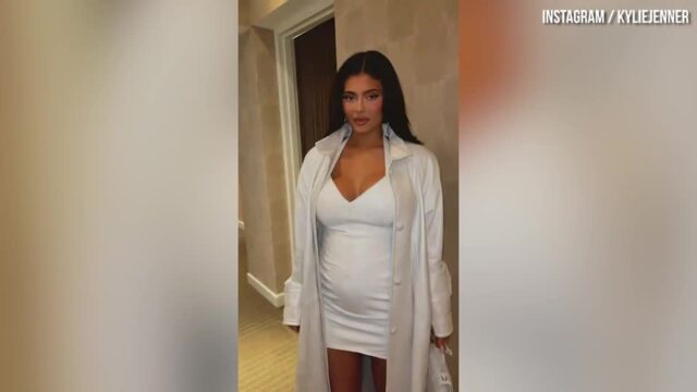 Kylie Jenner Shows Off Baby Bump During NYFW in White Leather Dress