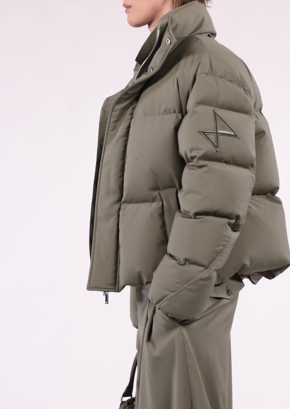 Water-repellent quilted down jacket in light wool with sailing patch