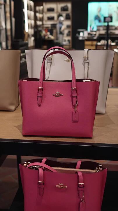magenta coach purse