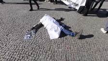 Activistas realizan un flashmob en Berlín contra las guerras