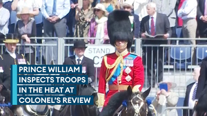 Prince of Wales inspects soldiers on horseback in heat at Colonel's Review
