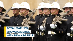 Royal Marines present arms and salute the King with the new KS-1 