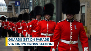 Coldstream Guards wow commuters as they take the train