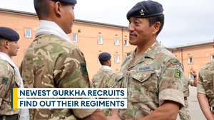 Gurkha recruits receive their regimental berets