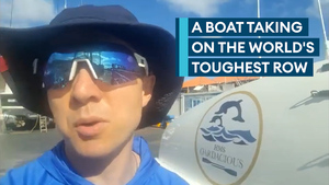 HMS Oardacious show off the boat taking on the world's toughest row
