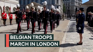 Belgian troops march with weapons in London parade