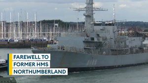 Retired HMS Northumberland towed out of HMNB Portsmouth