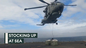 All hands on deck, and another in the sky as HMS Duncan gets a resupply