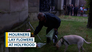 Mourners lay flowers at Holyrood Palace following death of Queen Elizabeth II