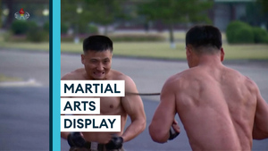 North Korean troops chop bricks and lie on bed of nails in front of Kim Jong Un