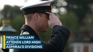 Prince William takes the salute from new naval officers at passing out parade