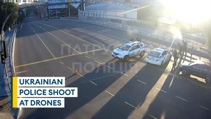 Ukrainian police officers fire at drones in Kyiv