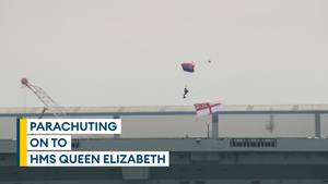 Parachutists land on one of the Royal Navy's aircraft carriers