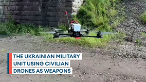 Ukrainian soldiers use modified civilian drones to carry explosives