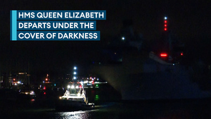 Royal Navy's flagship departs under the cover of darkness into the Solent