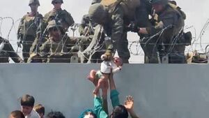 Army Medic On Nursing Afghan Baby After Being Passed Over Wall