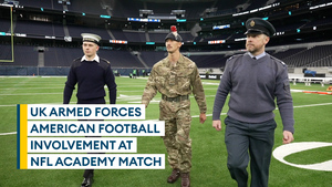 British military personnel involved in pre-match presentation for UK NFL Academy match