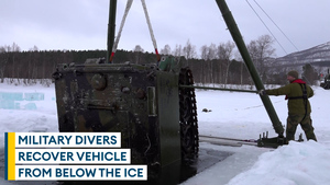 Watch: Army divers recover an armoured personnel carrier from under a frozen lake