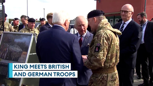 King meets German-UK battalion near Berlin