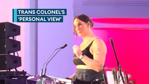 Trans colonel removes mess dress before keynote speech