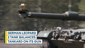 German Leopard 2 balances glassful of beer on its gun