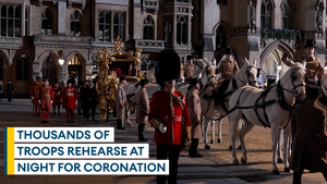 Glimpse the coronation as thousands of troops take part in early-morning London rehearsals
