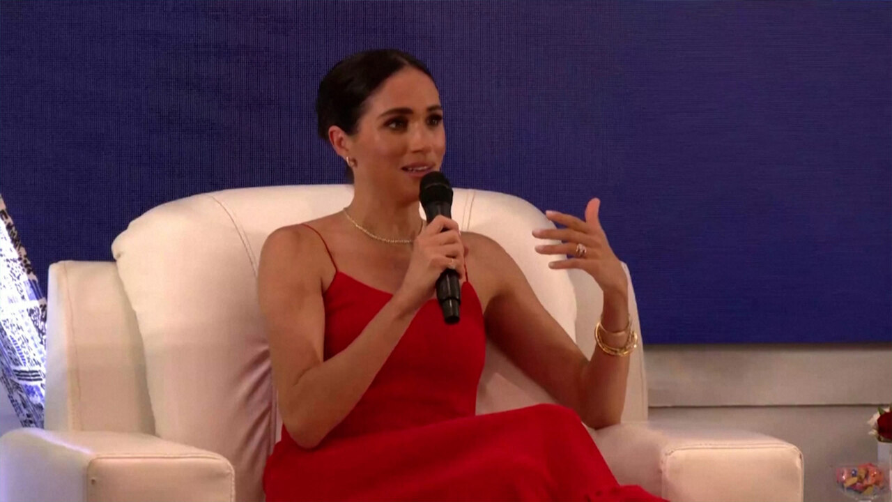 meghan red dress nigeria The seven ways Meghan styled her Nigeria trip like a royal tour
