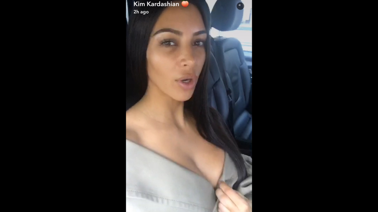 Kim Kardashian Diverts Attention From Makeup Free Face With Cleavage Baring Outfit At Paris Fashion Week