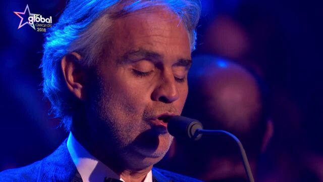 Andrea Bocelli at the piano with his wife Enrica Cenzatti and their son Amos.  The Italian tenor Andrea Bocelli seated at the …