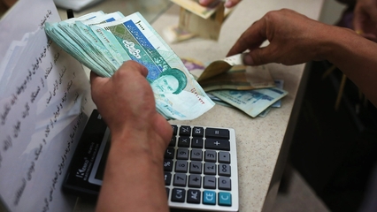 Iran’s currency drops to record low against dollar as tensions soar

