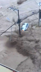 Typhoon floods wash away containers and cars in Philippines