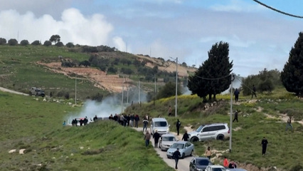 Palestinians flee tear gas as Israeli settlers arrive in occupied West Bank
