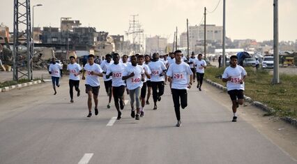Gaza athletes defy war scars as marathon returns to coastal road