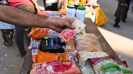 Palestinians in Gaza barter for survival as Israel’s war collapses the banking system