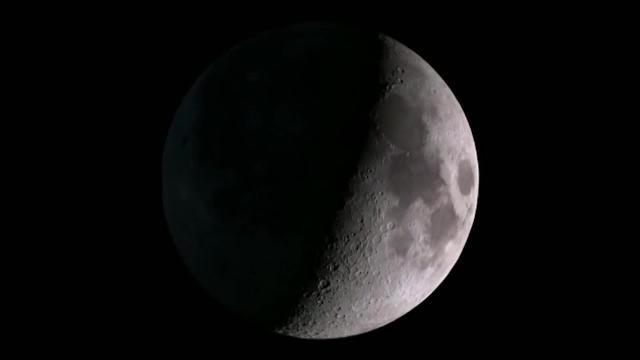 Cartel de la NASA reflejando el establecimiento de un laboratorio orbital en la Luna, como paso anterior a enviar astronautas al satélite