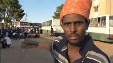 Los combates entre las milicias en Libia atrapan a cientos de migrantes que habían llegado al país camino a Europa